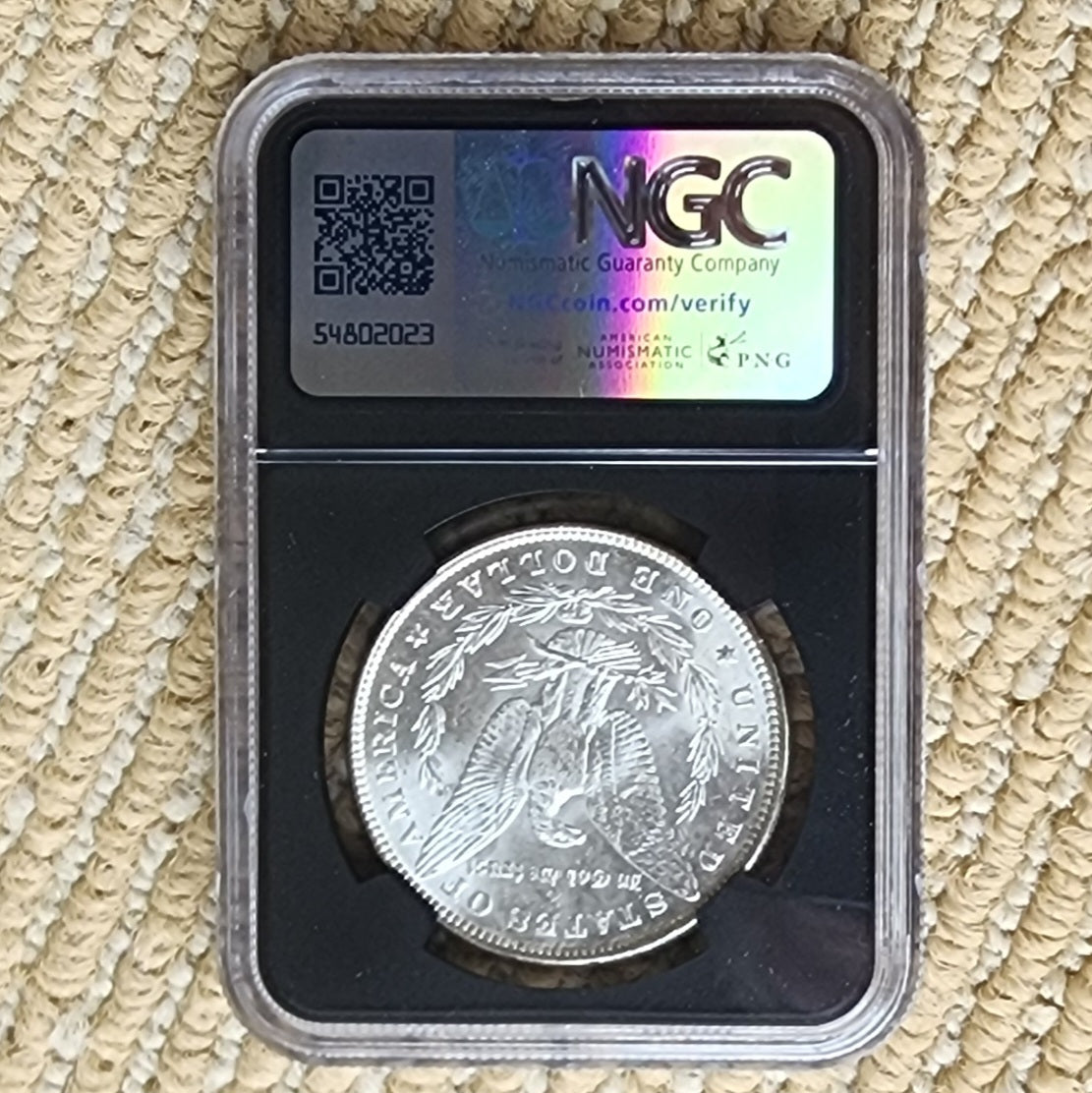 Pre-1921 NGC MS-63 Morgan Silver Dollar in Original Bag Fragment Holder
